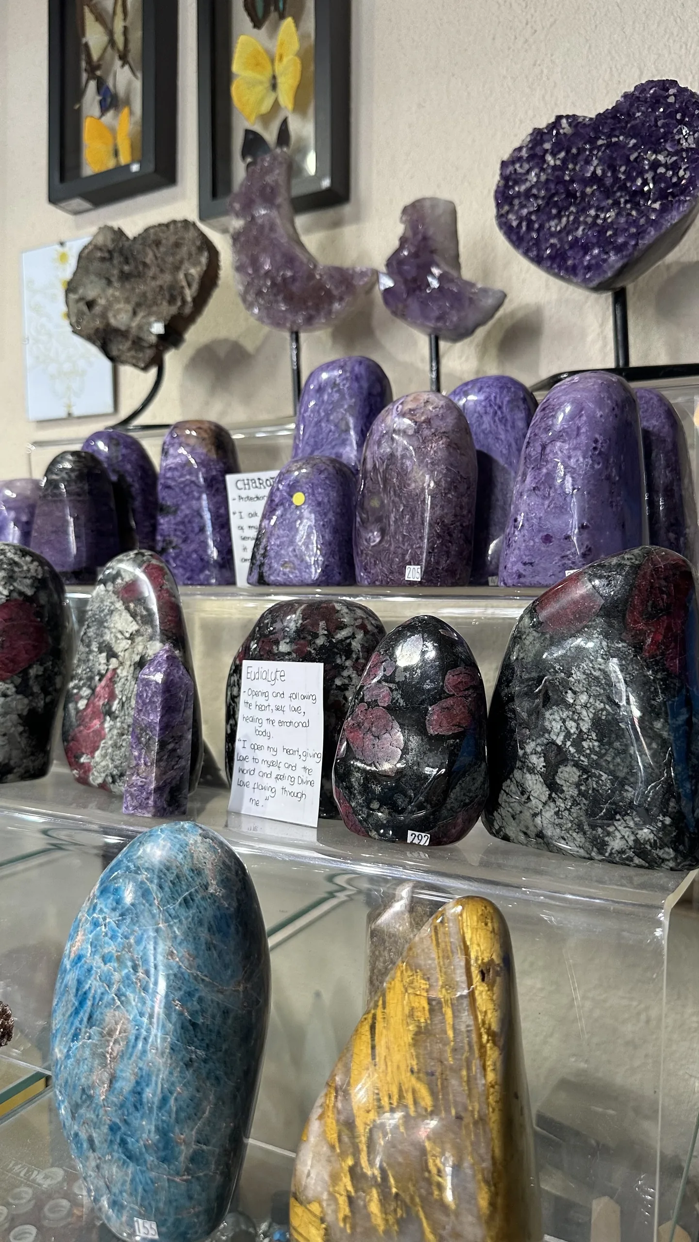 Polished charoite, eudialyte and blue apatite collector stones at Stone Room